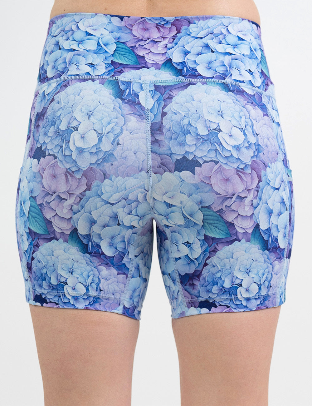 back of the 5 inch blue and purple pastel flowers shorts against a white background