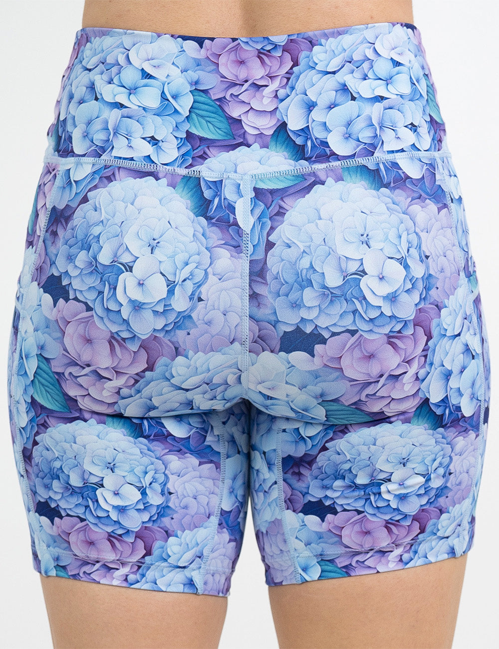 back of the 7 inch blue and purple pastel flowers shorts against a white background