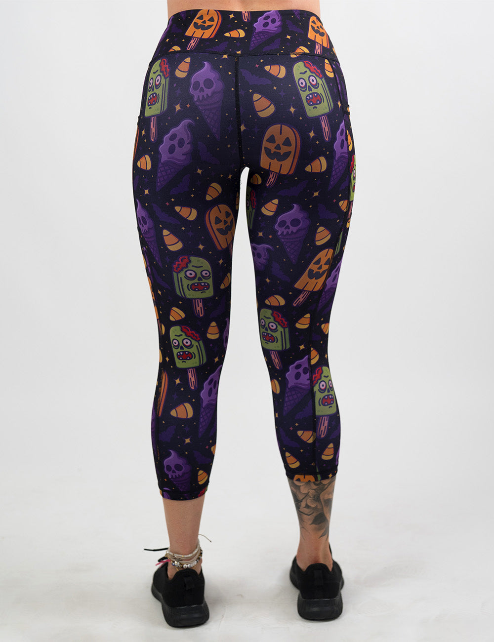 back of the zombie, jack o lantern, and ghost ice cream capri leggings against a white background