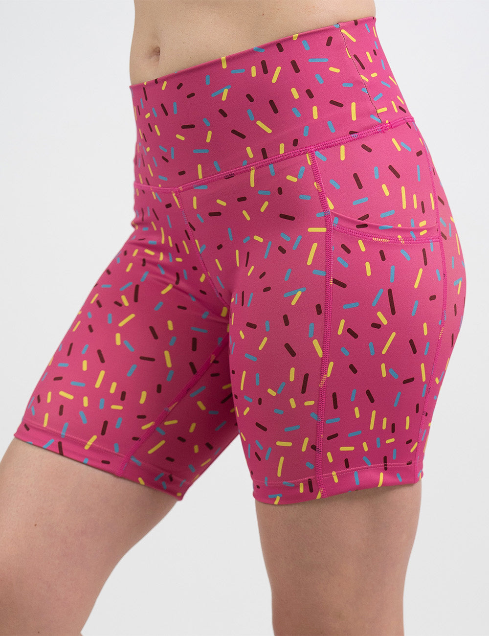 front of the 7 inch pink shorts with a sprinkles pattern against a white background