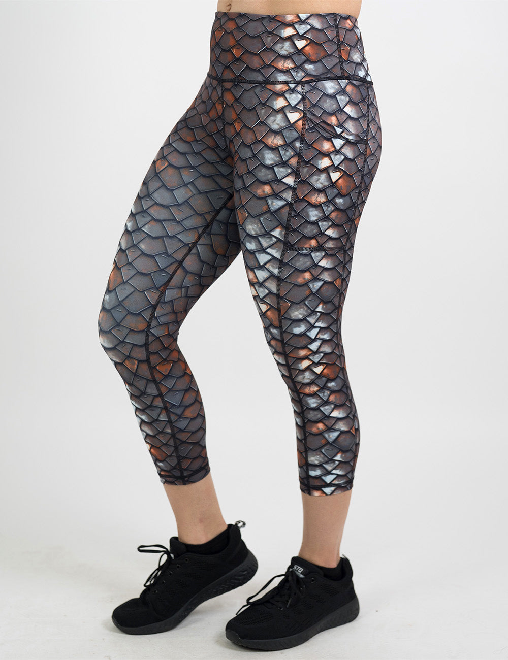 front of the iron scales pattern capri leggings against a white background