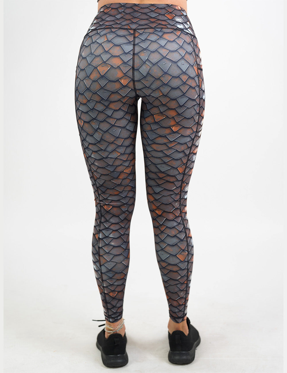 back of the full length iron scales leggings against a white background