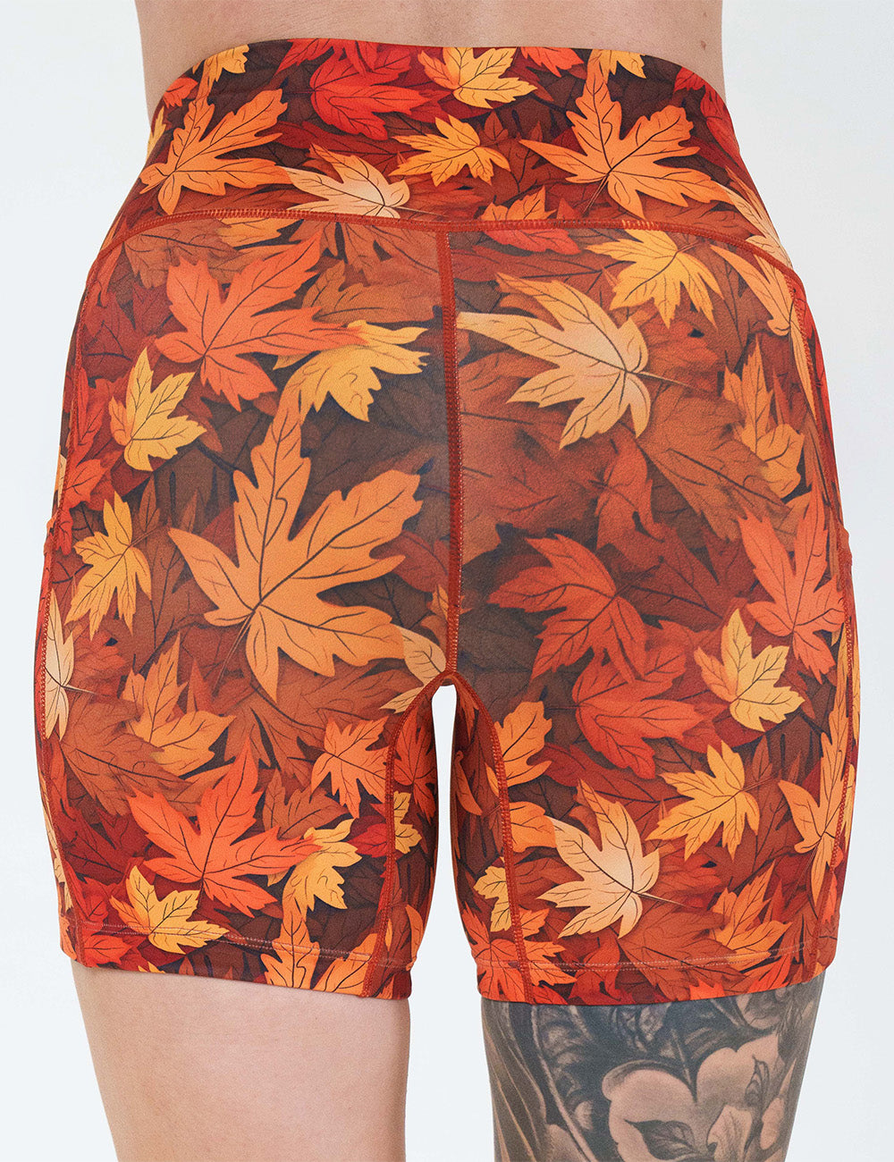 back of the 5 inch orange leaves shorts against a white background