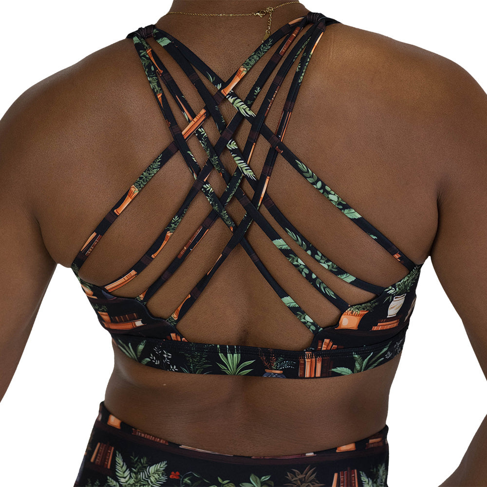back of the floral patterned sports bra with books design on it