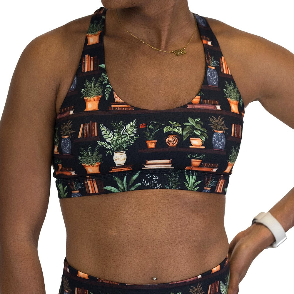 floral patterned sports bra with books design on it