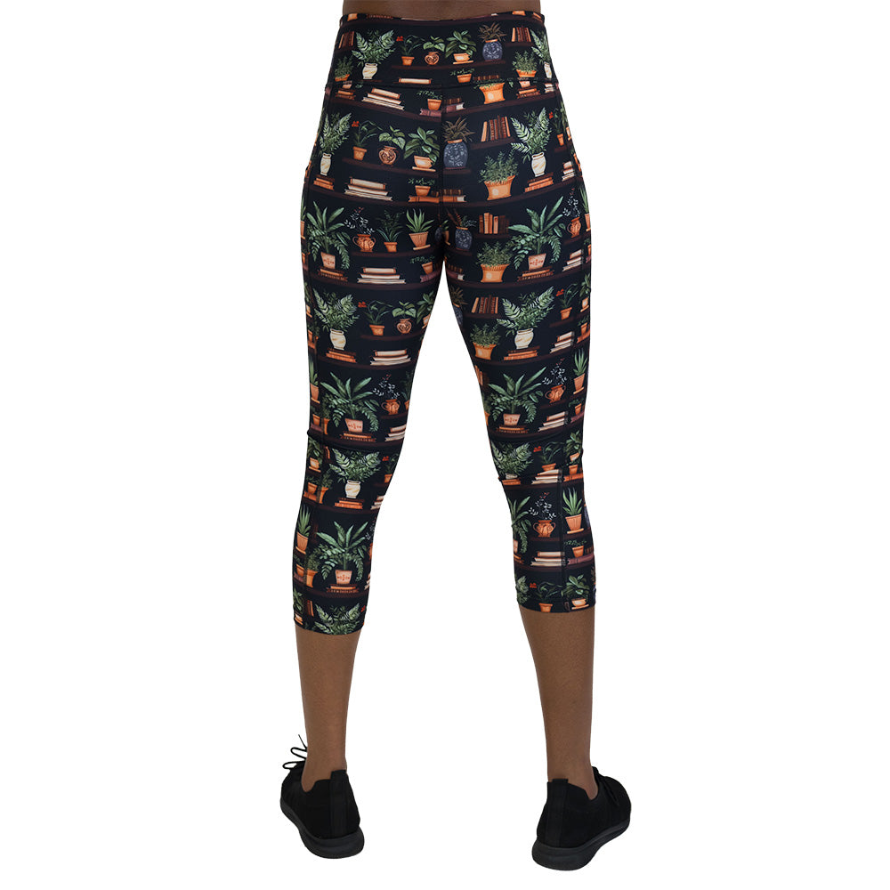 back of the floral patterned leggings with books design on it