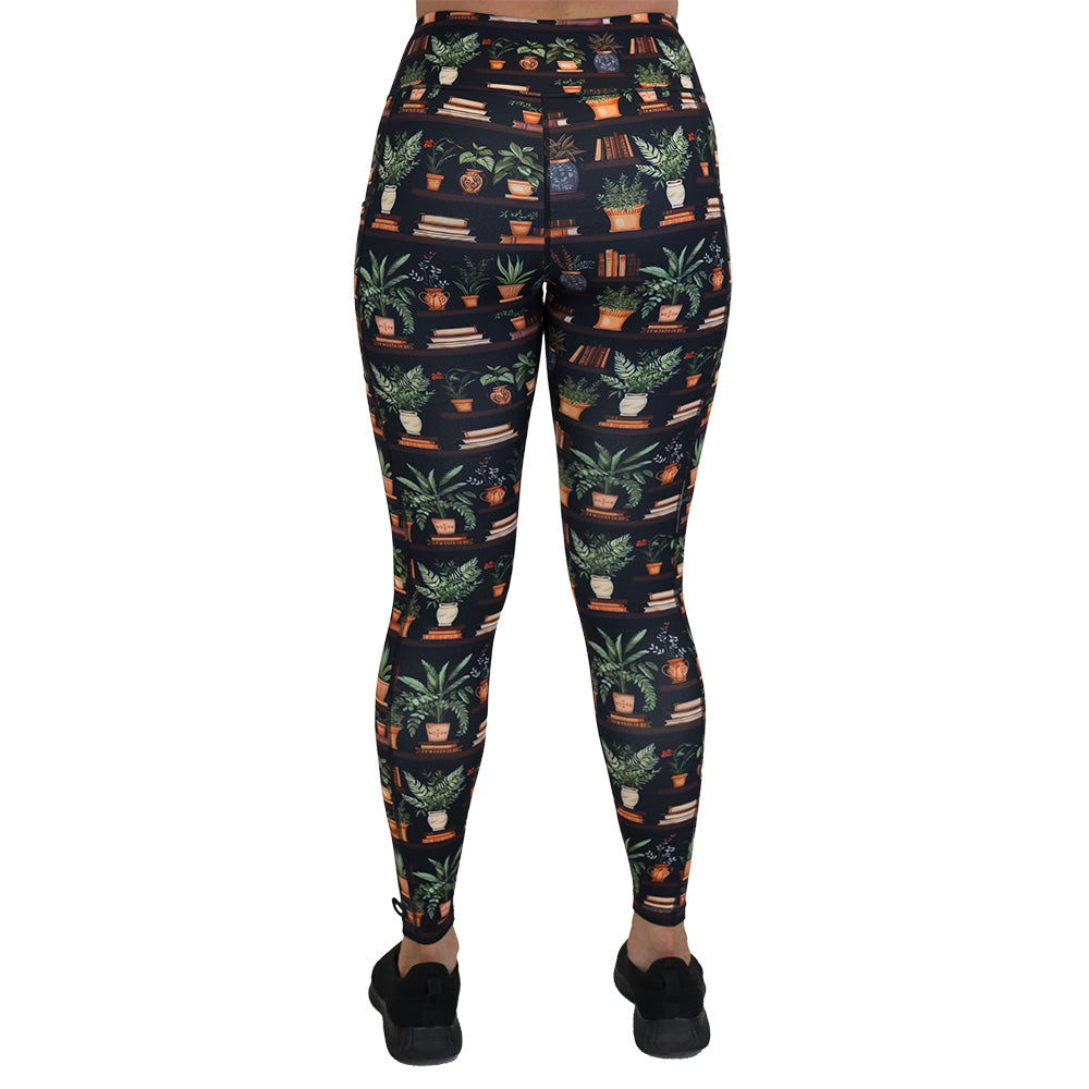 back of the floral patterned leggings with books design on it