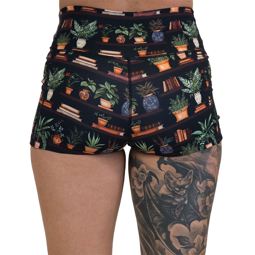 back of the floral patterned shorts with books design on it
