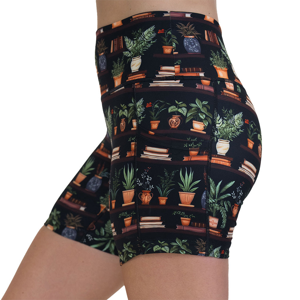 floral patterned shorts with books design on it