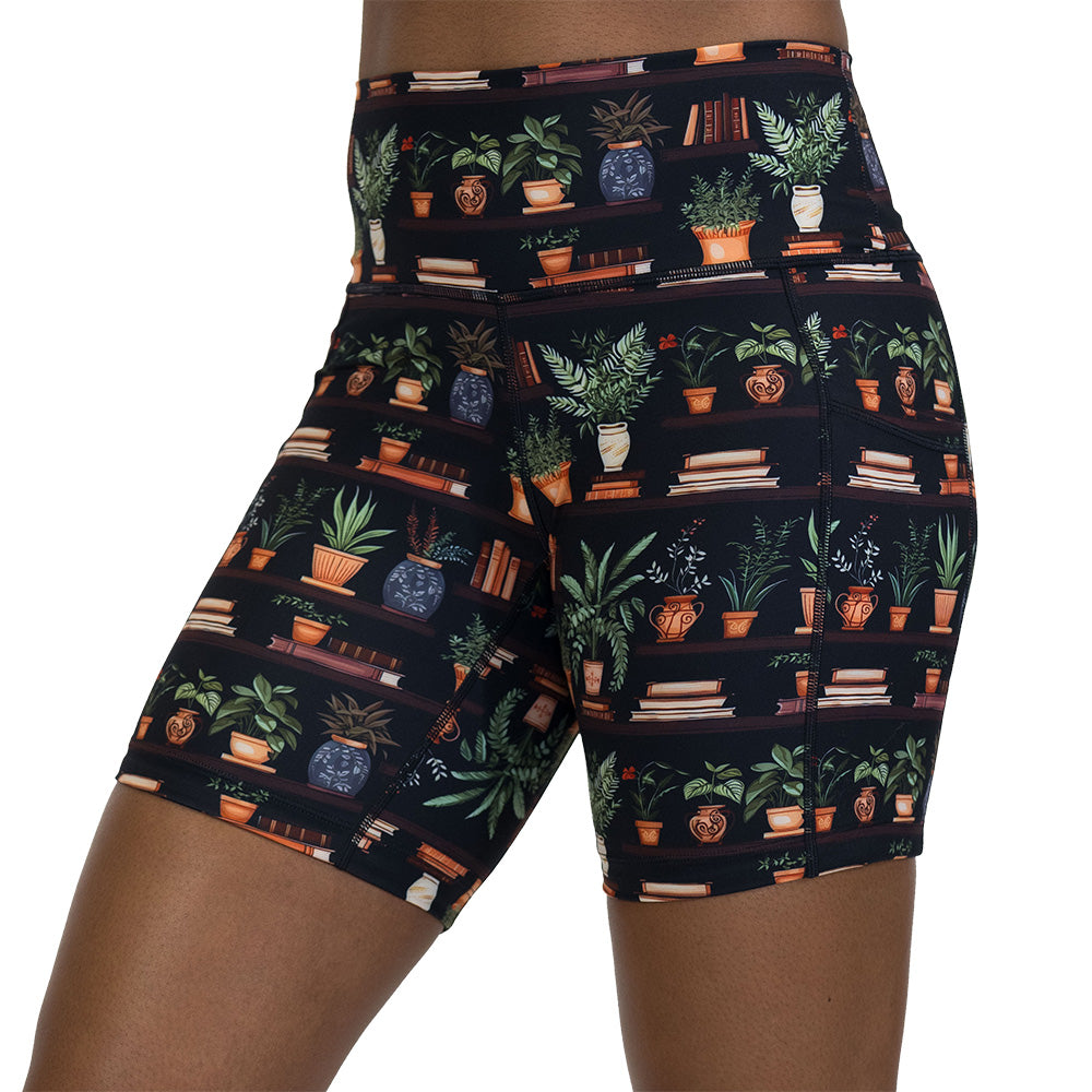 floral patterned shorts with books design on it