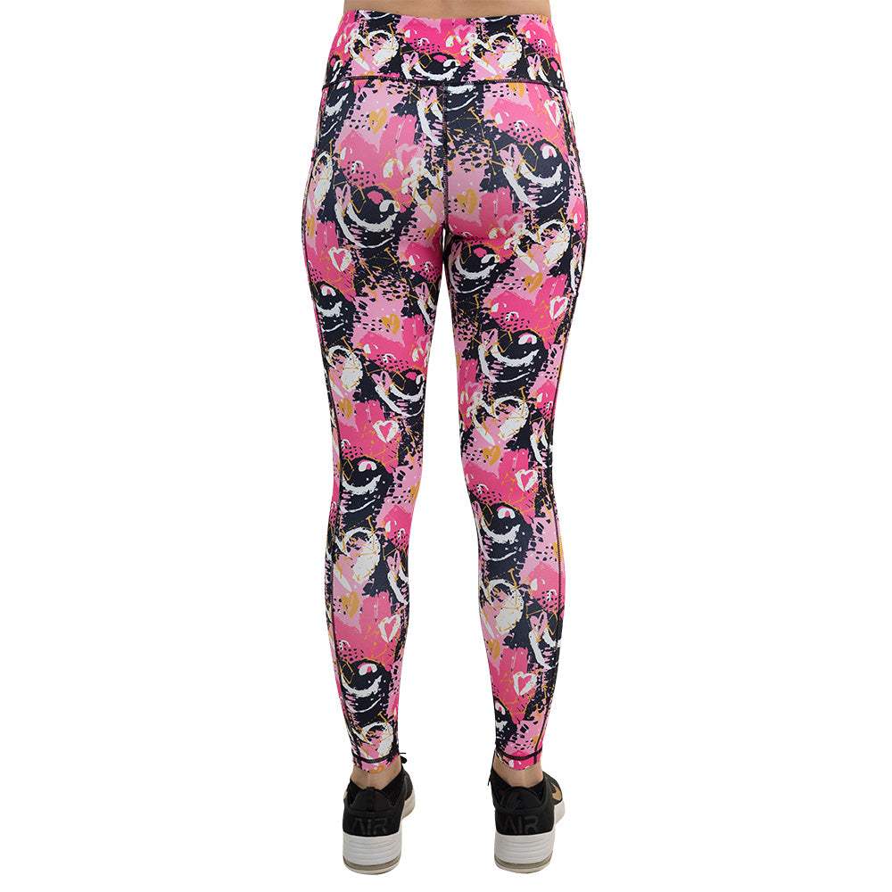back of the white hearts against a bold pink, black, and yellow pattern full length leggings against a white background