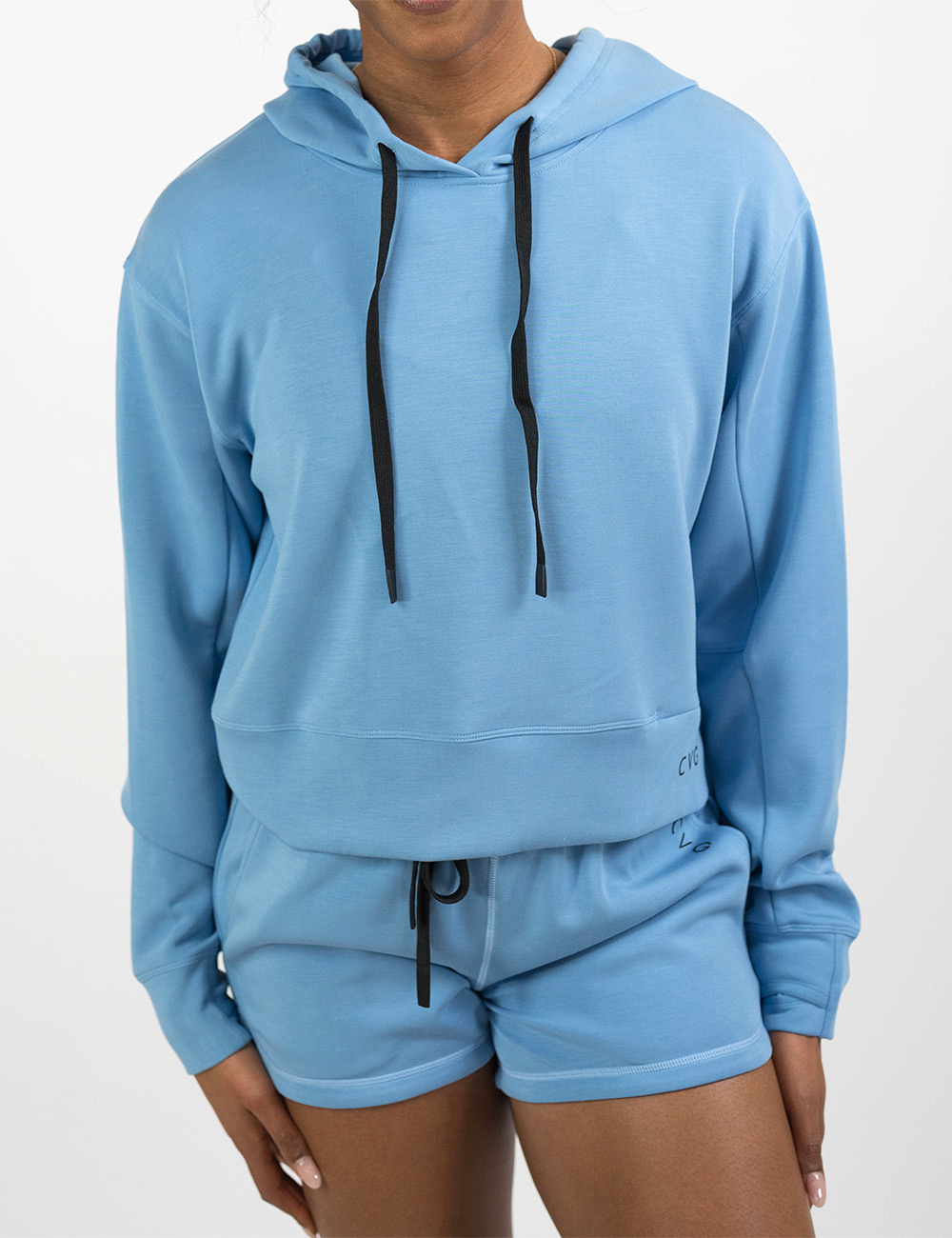 front of the light blue sweatshirt with black drawstrings against a white background