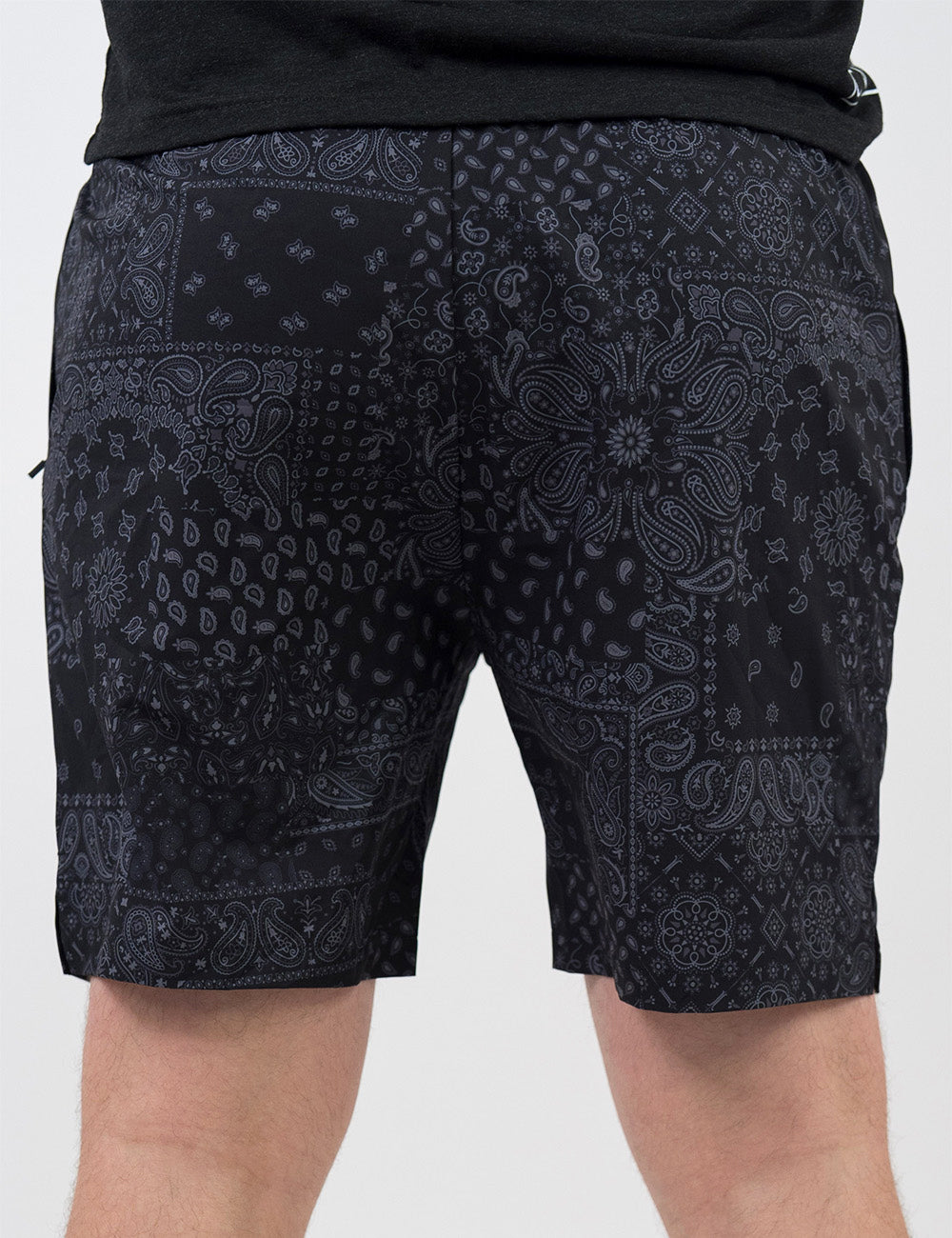 back of the black men's shorts with a grey paisley pattern against a white background