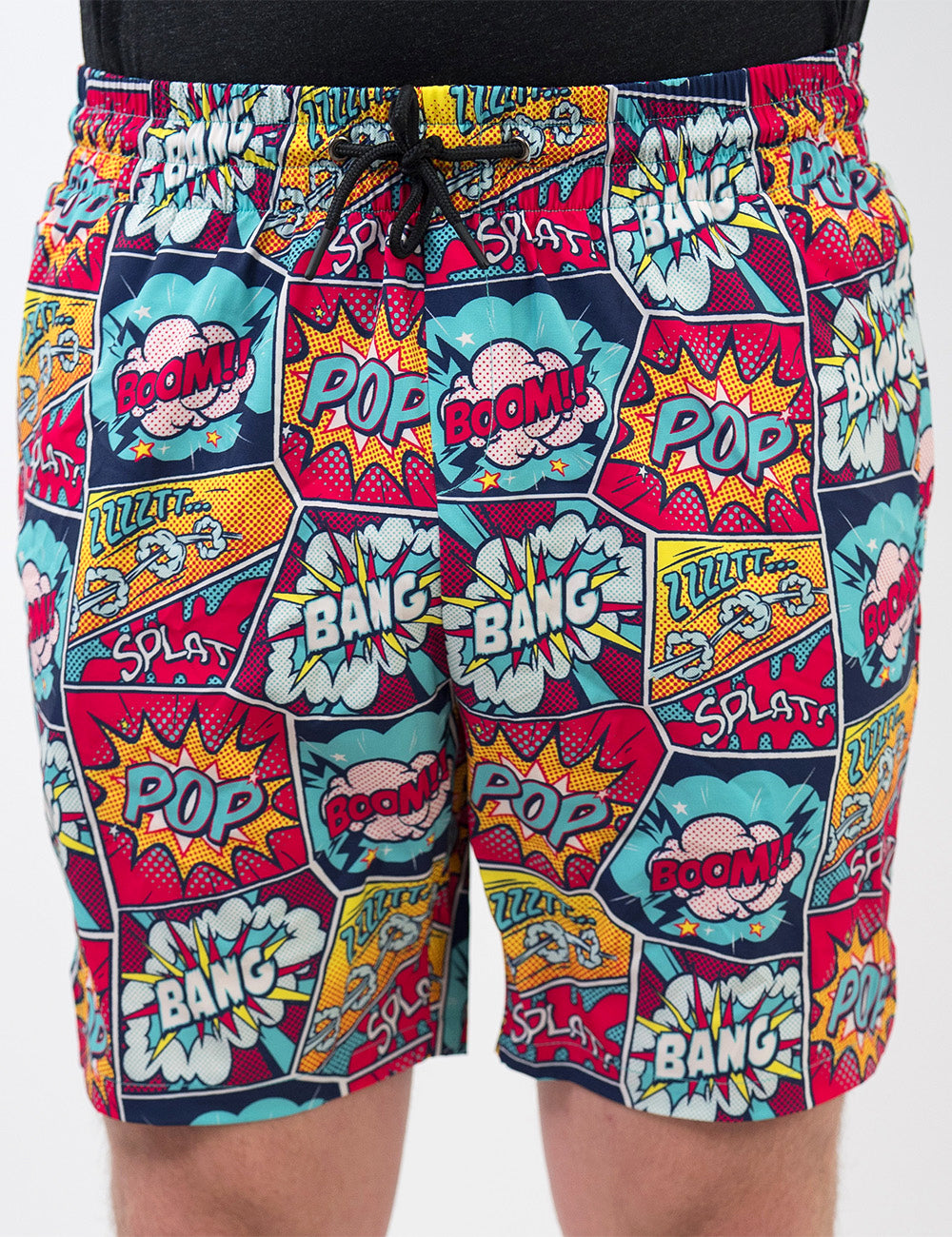 front of the comic book themed men's shorts against a white background