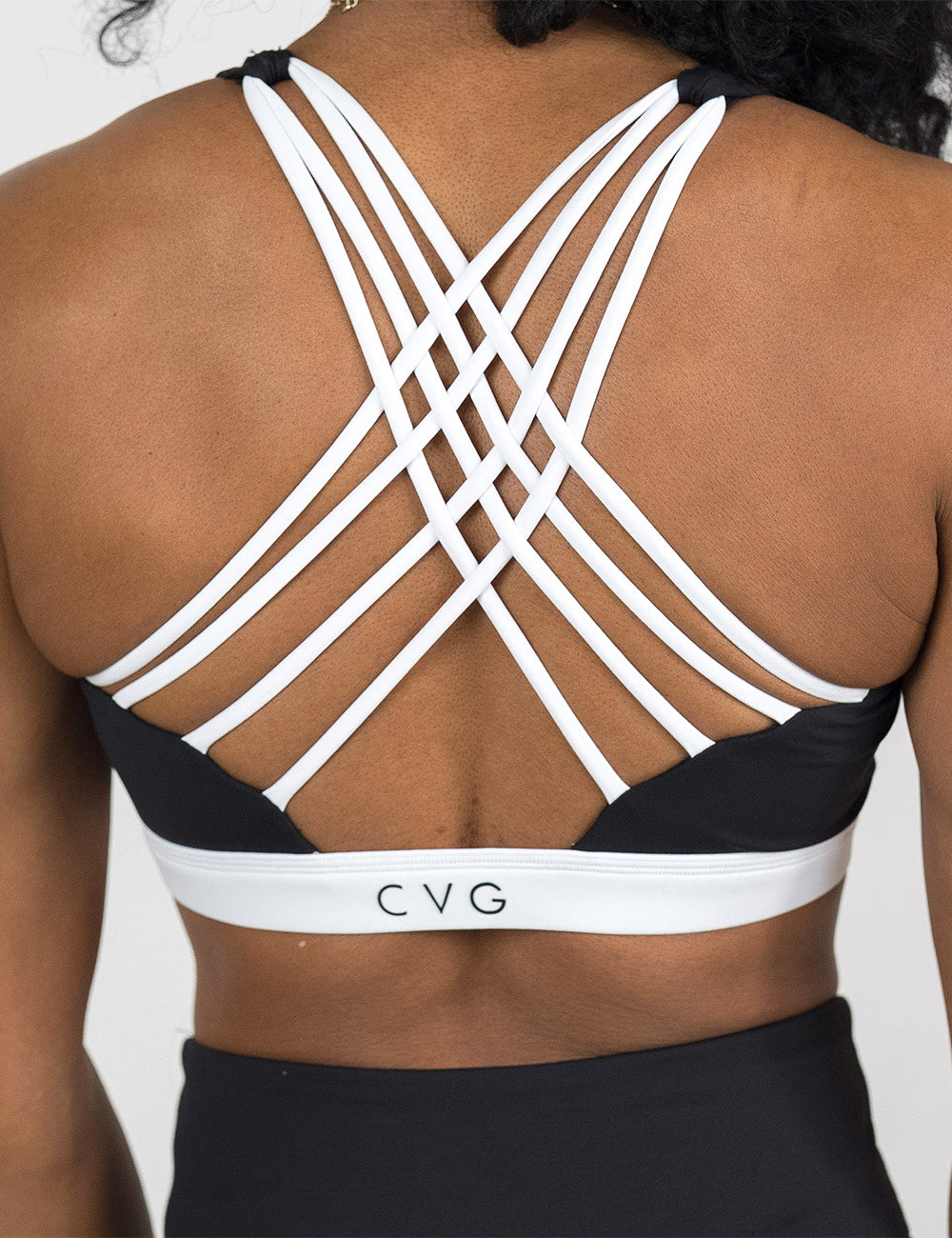 back of the monochrome butterfly back bra with white accents against a white background