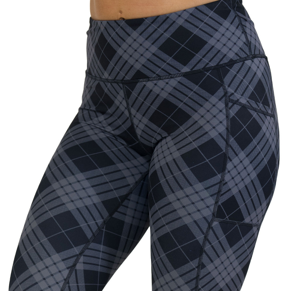 Plaid patterned leggings on a white background