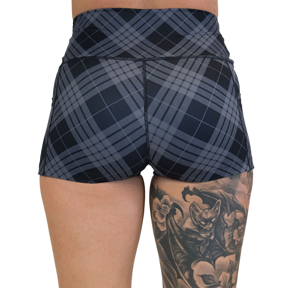 back of the plaid patterned shorts on a white background
