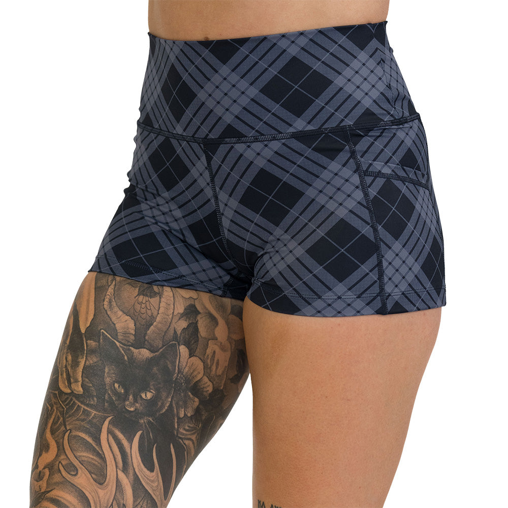 Plaid patterned shorts on a white background