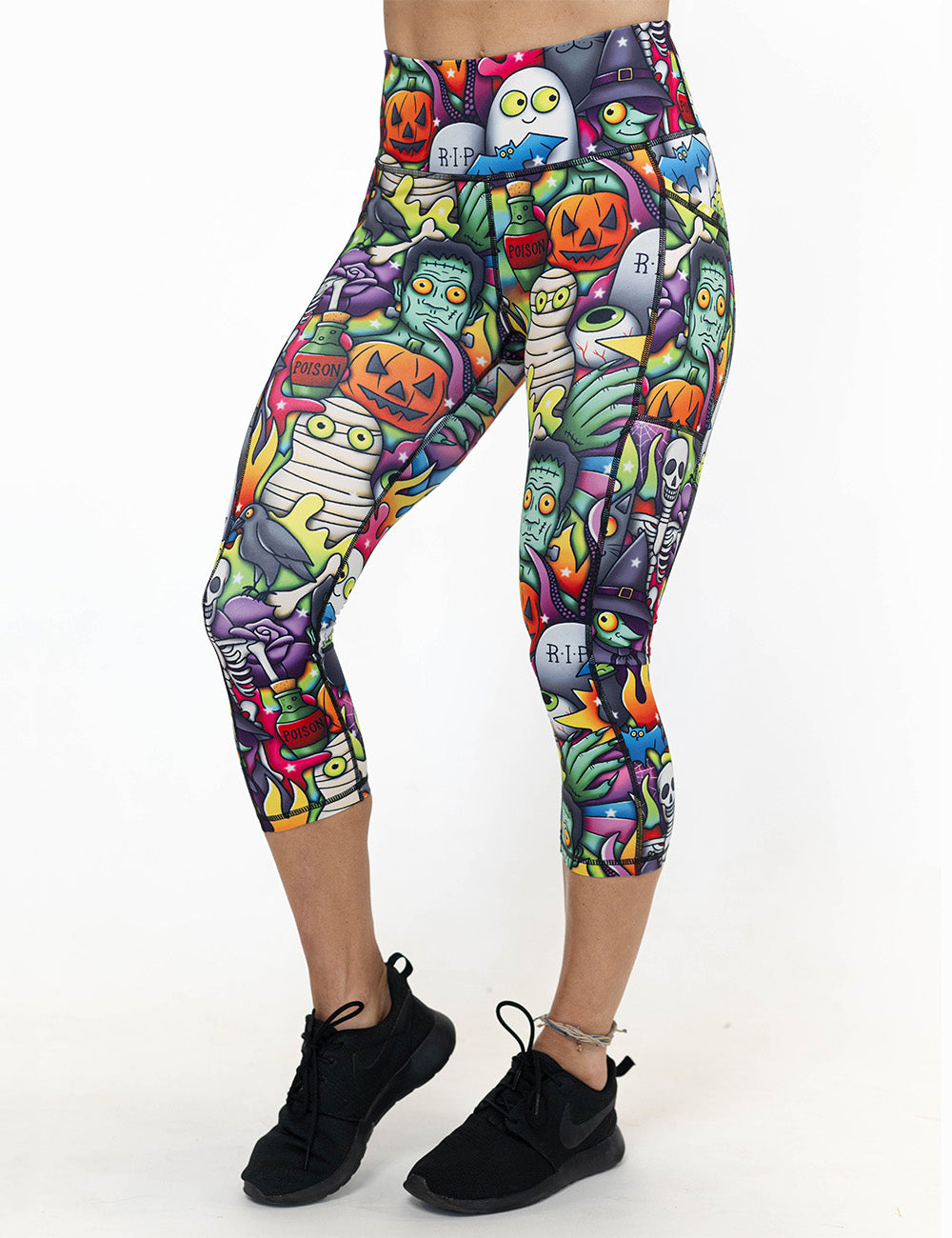 front of the Halloween characters capri leggings against a white background
