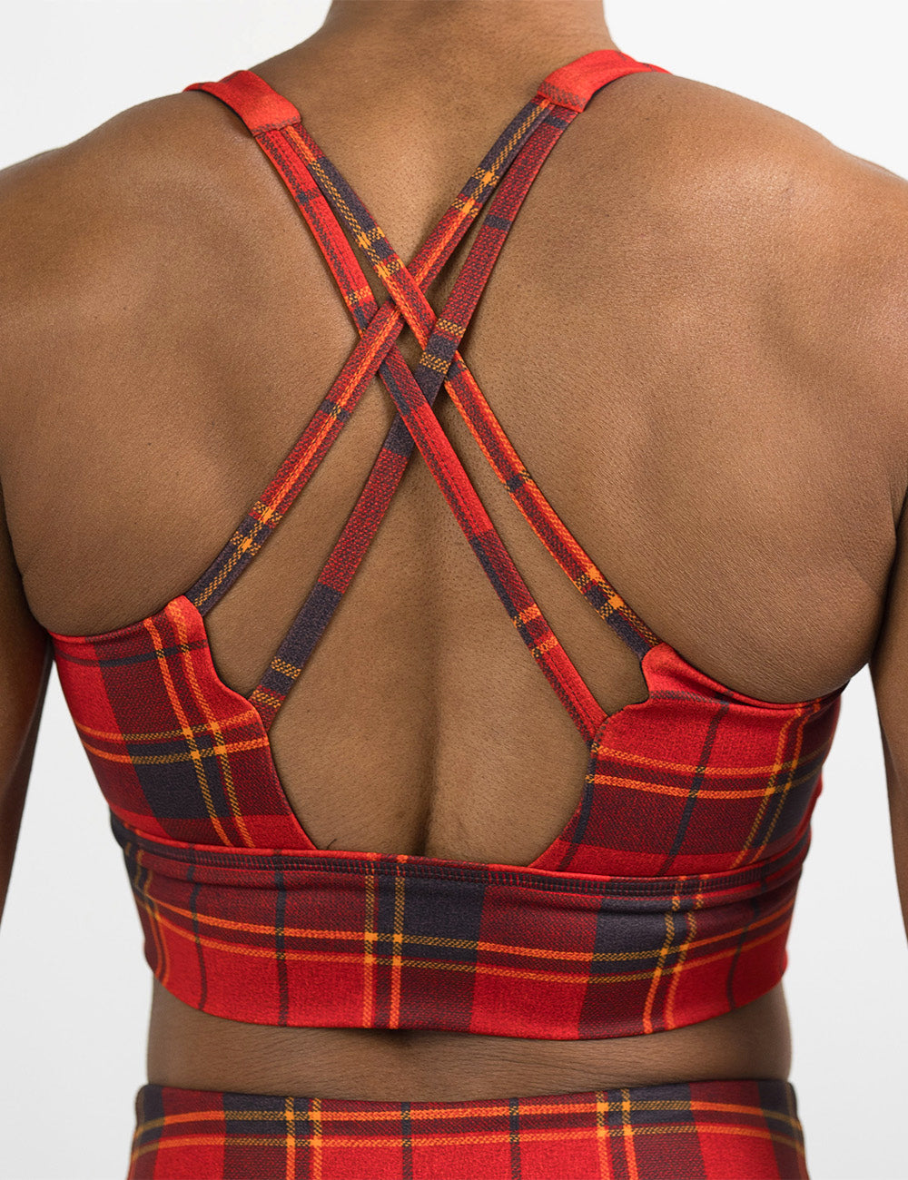 back of the red, dark red, and yellow plaid bra against a white background