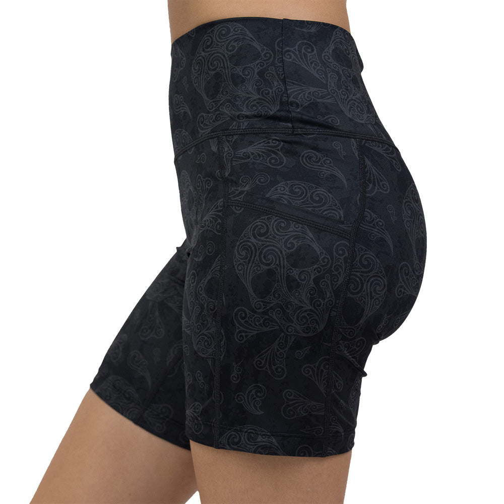 7 inch dark pirate themed skull and cross bones print shorts facing the side