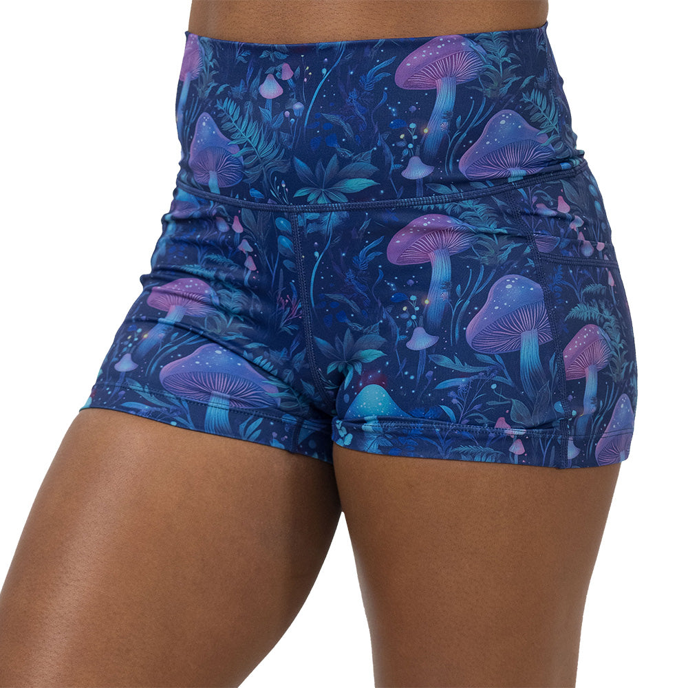 shorts with a blue and purple mushroom and foliage design on a white background