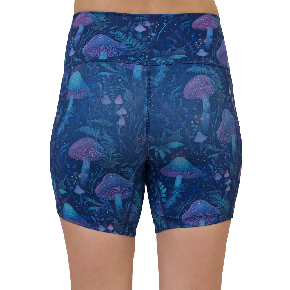 back of the shorts with a blue and purple mushroom and foliage design on a white background
