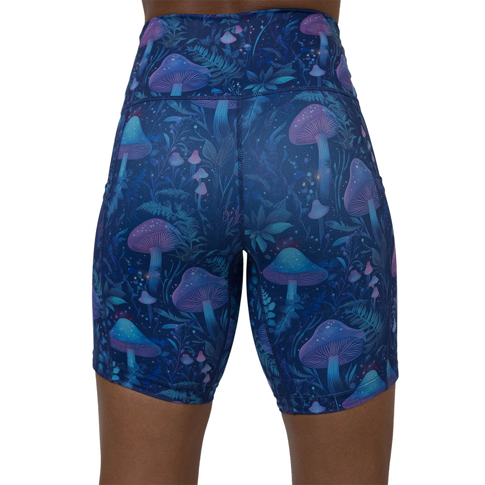 back of the shorts with a blue and purple mushroom and foliage design on a white background