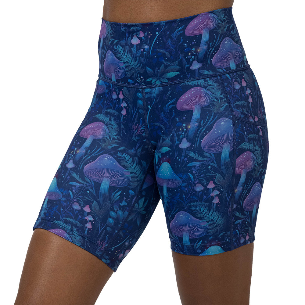 shorts with a blue and purple mushroom and foliage design on a white background