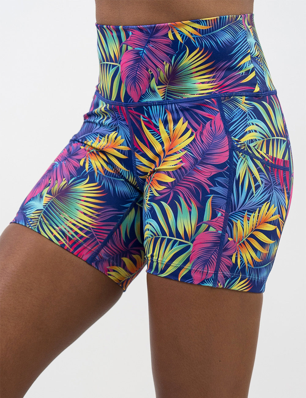 front of the 5 inch vibrant tropical leaves shorts against a white background