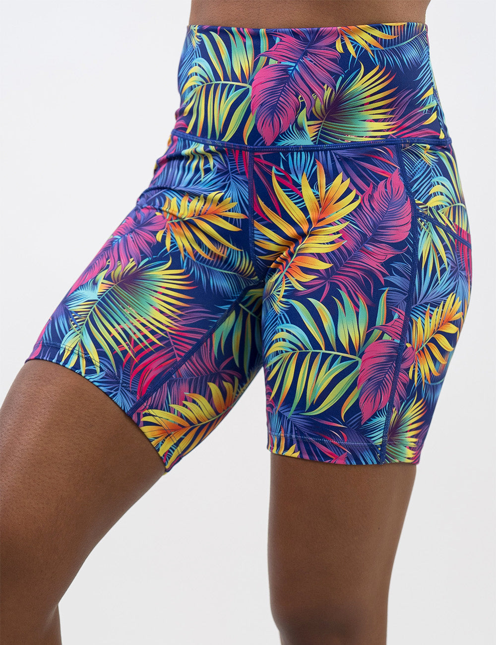 front of the 7 inch vibrant tropical leaves shorts against a white background
