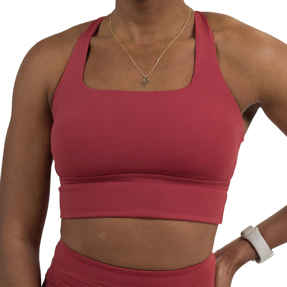front of the omni garnet red longline bra against a white background