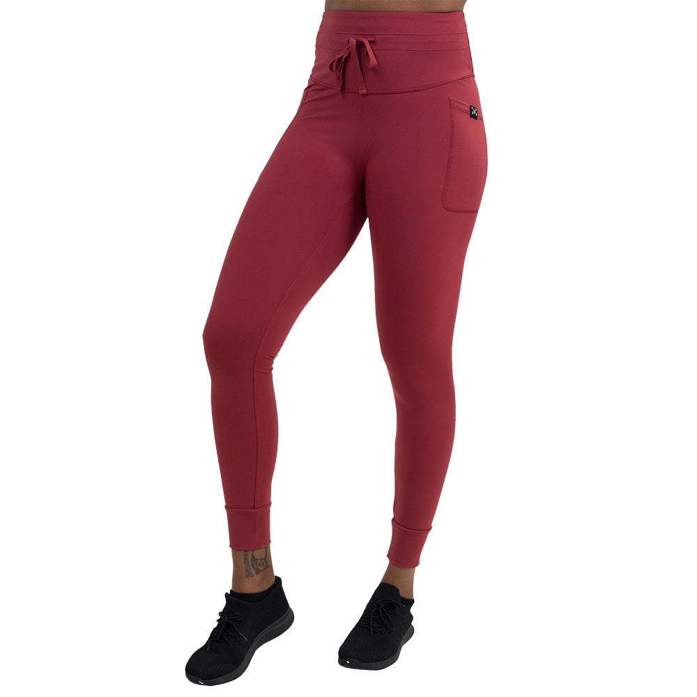 front of the omni garnet red full length leggings against a white background