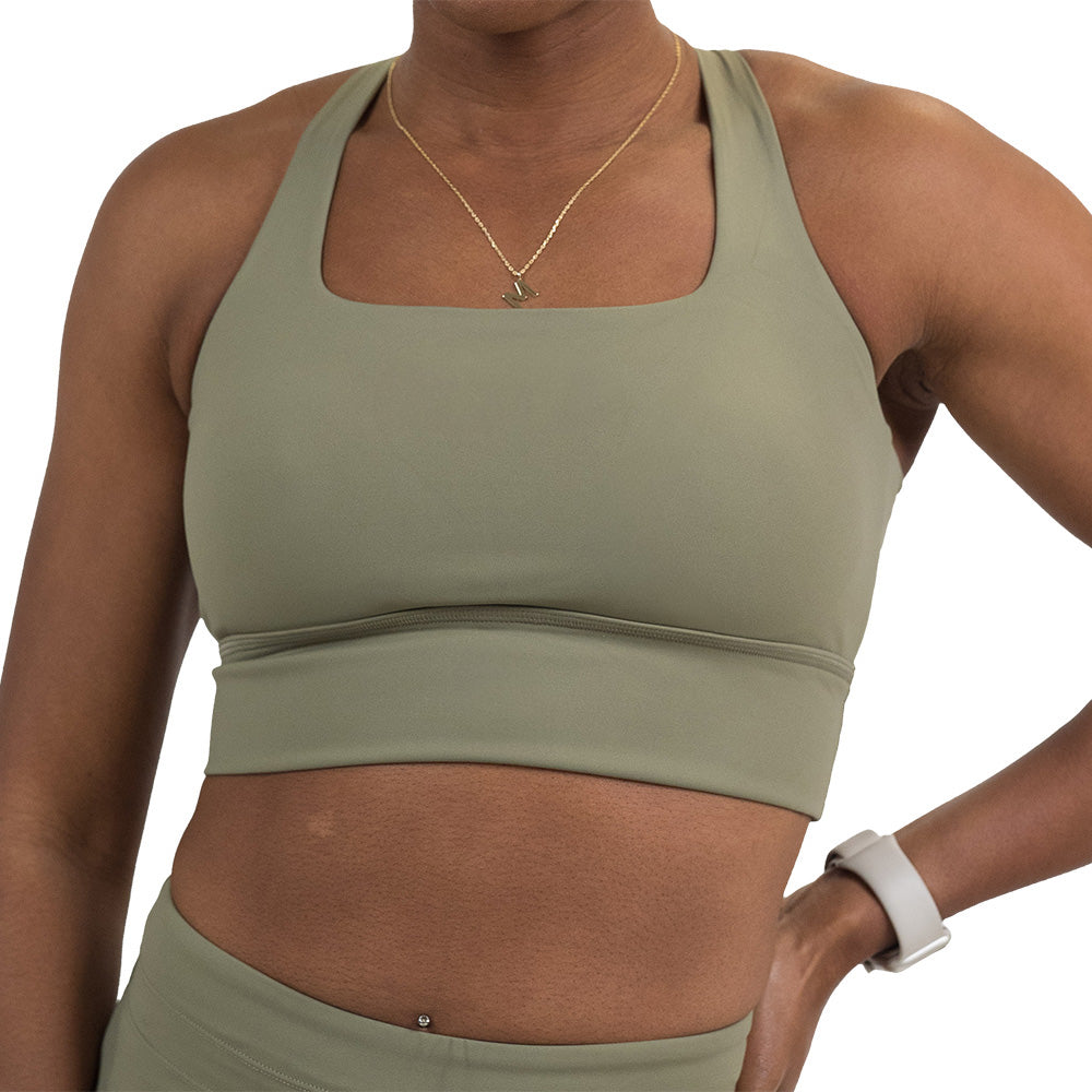 front of the omni green tea longline bra against a white background
