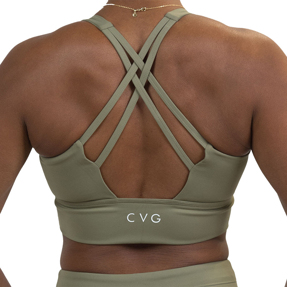 back of the omni green tea longline bra against a white background