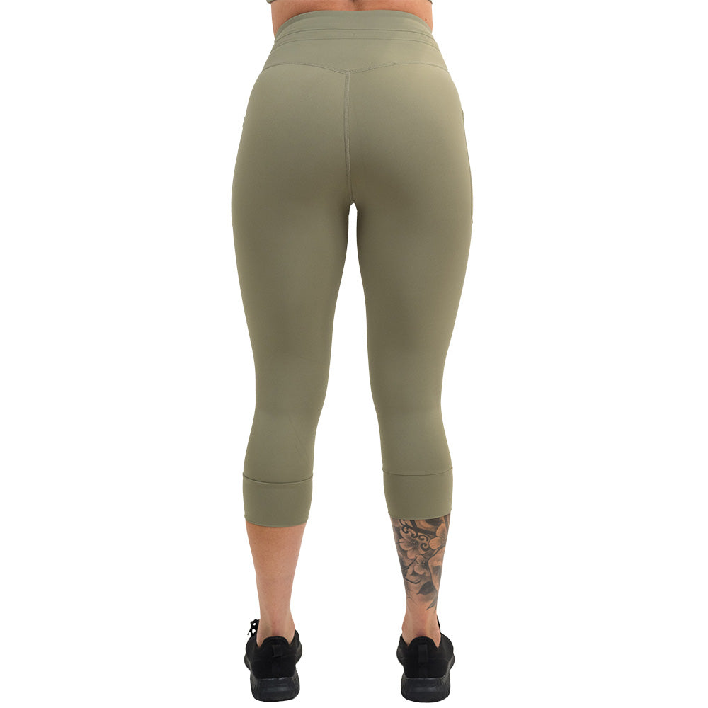 back of the omni green tea capri leggings against a white background