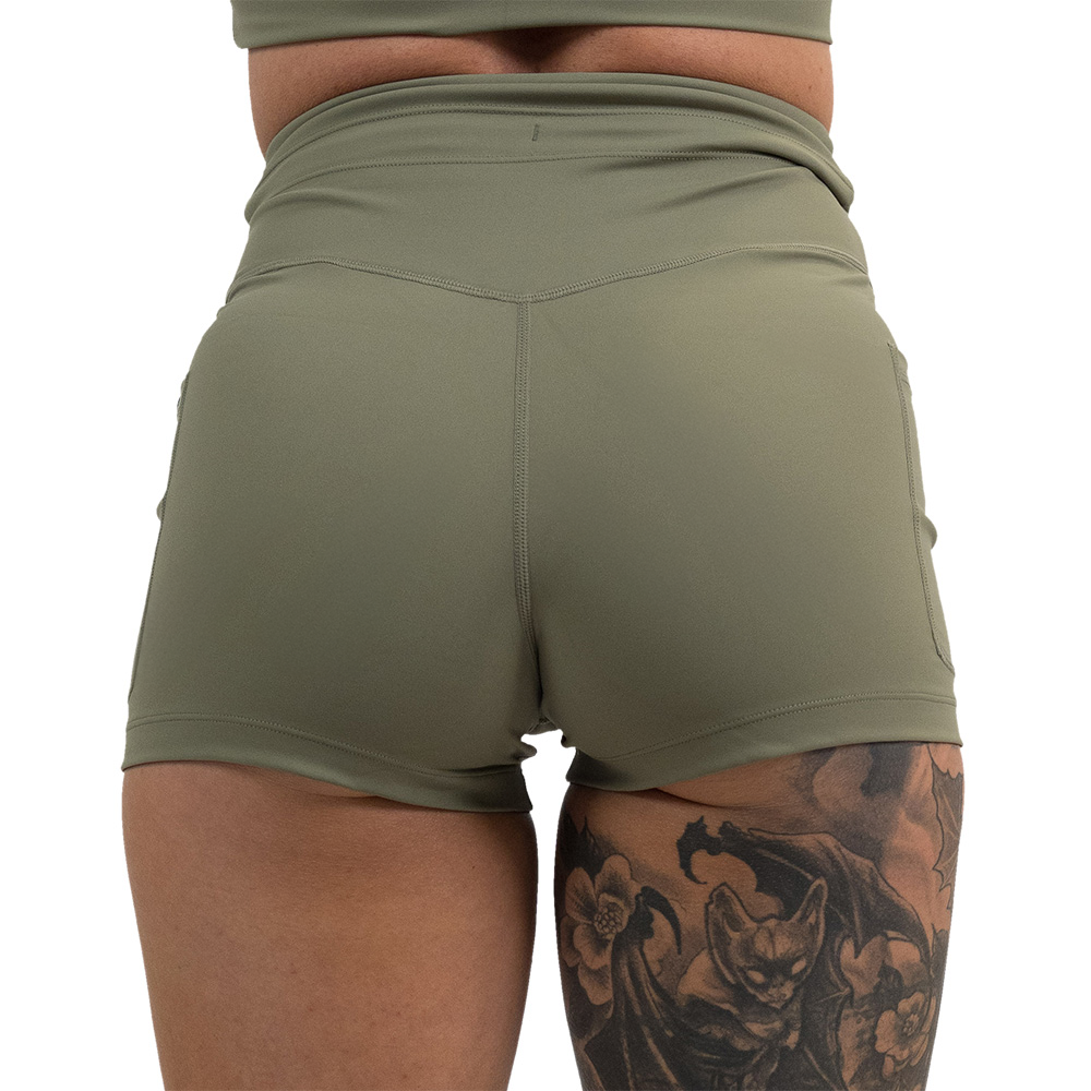 back of the omni green tea 2.5 inch shorts against a white background