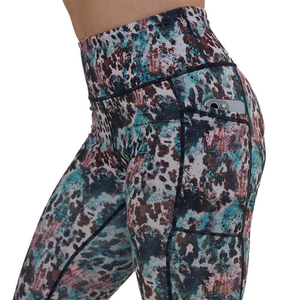 side pocket on the leopard print with teal paint splatter leggings