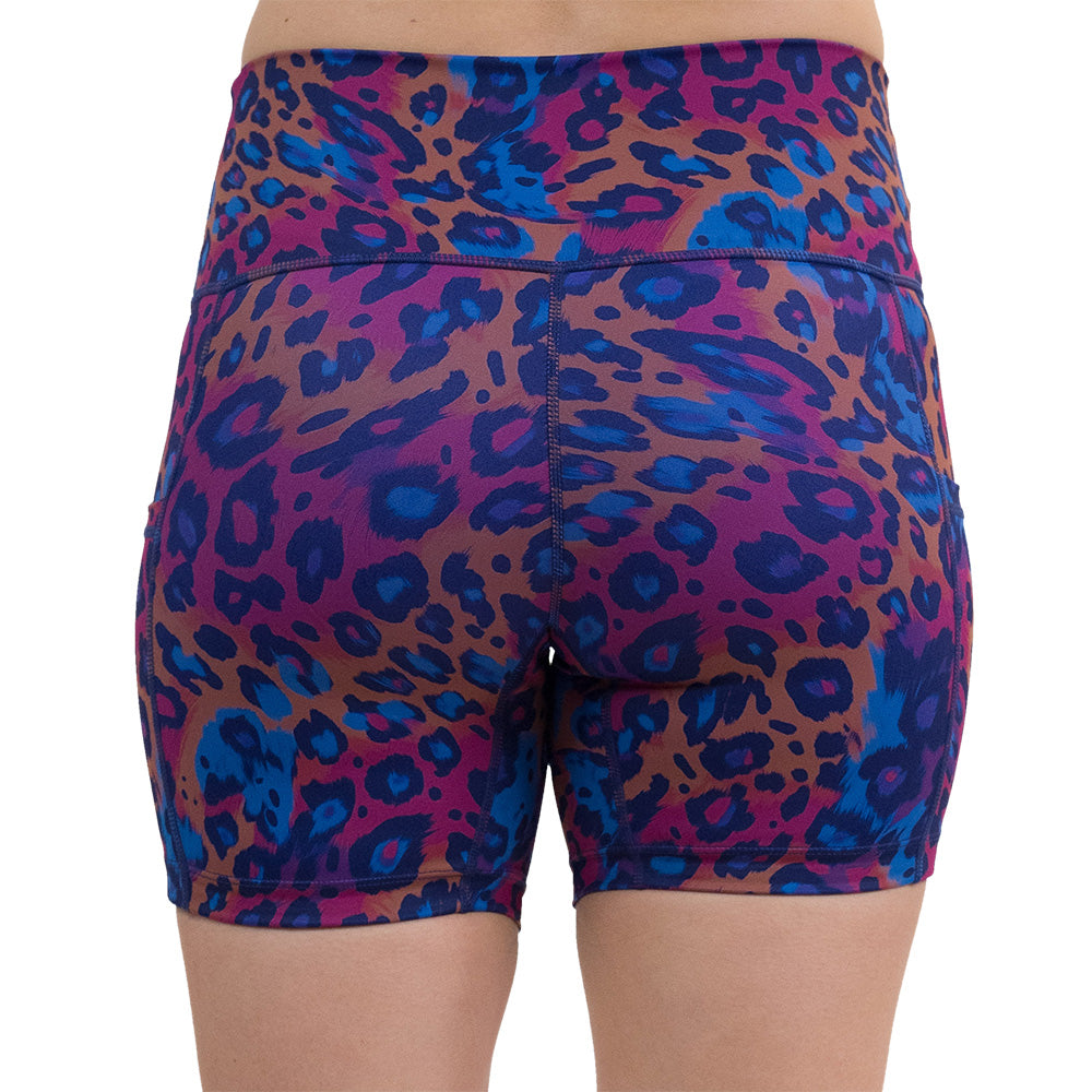 back of the 5 inch cheetah print against a yellow, blue, and purple background pattern shorts against a white background
