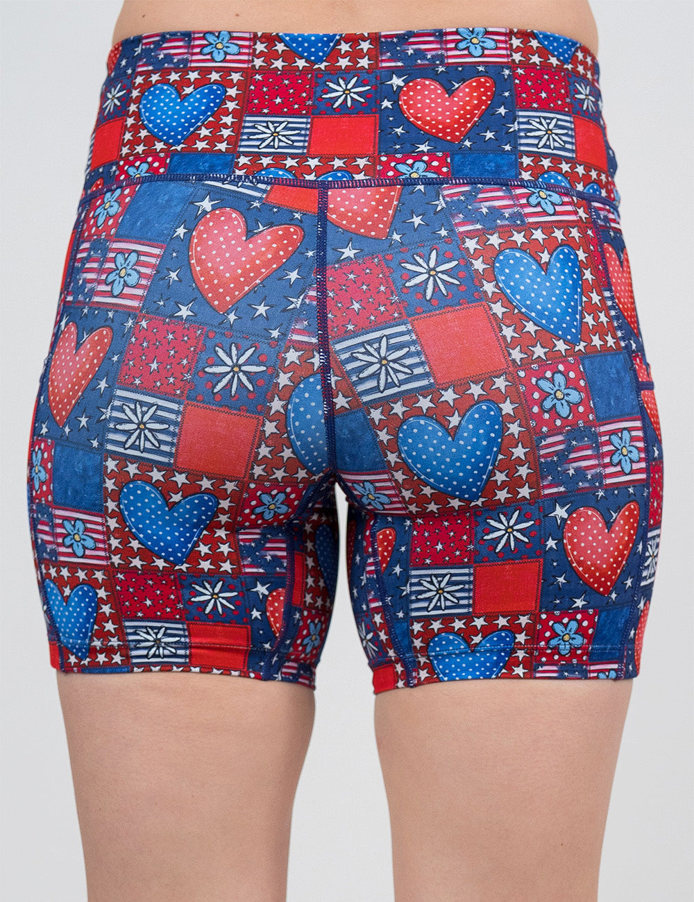 back of the 5 inch patchwork american flag with red and blue hearts pattern shorts against a white background