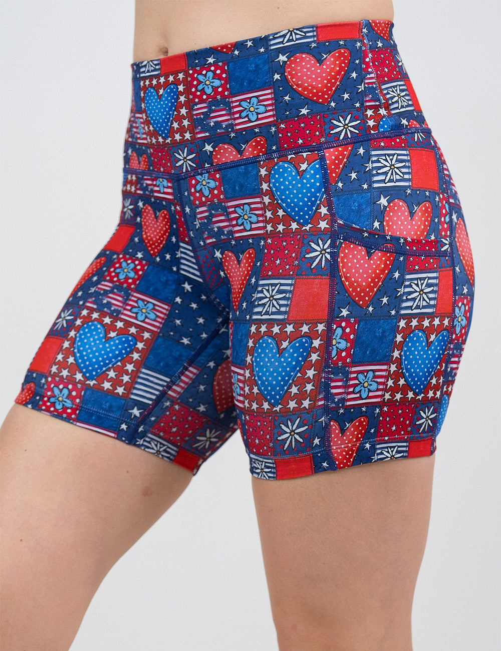 front of the 5 inch patchwork american flag with red and blue hearts pattern shorts against a white background