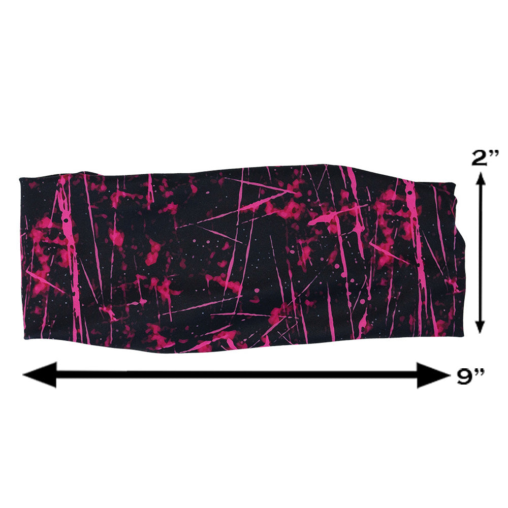pink paint splatter patterned headband measured at 2 by 9 inches