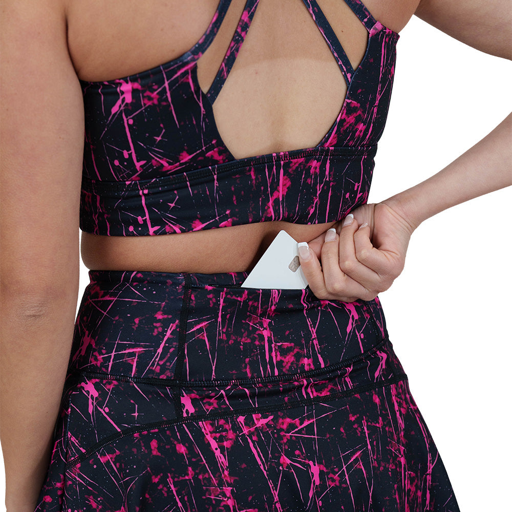 close up of the back pocket on the pink paint splatter patterned skirt