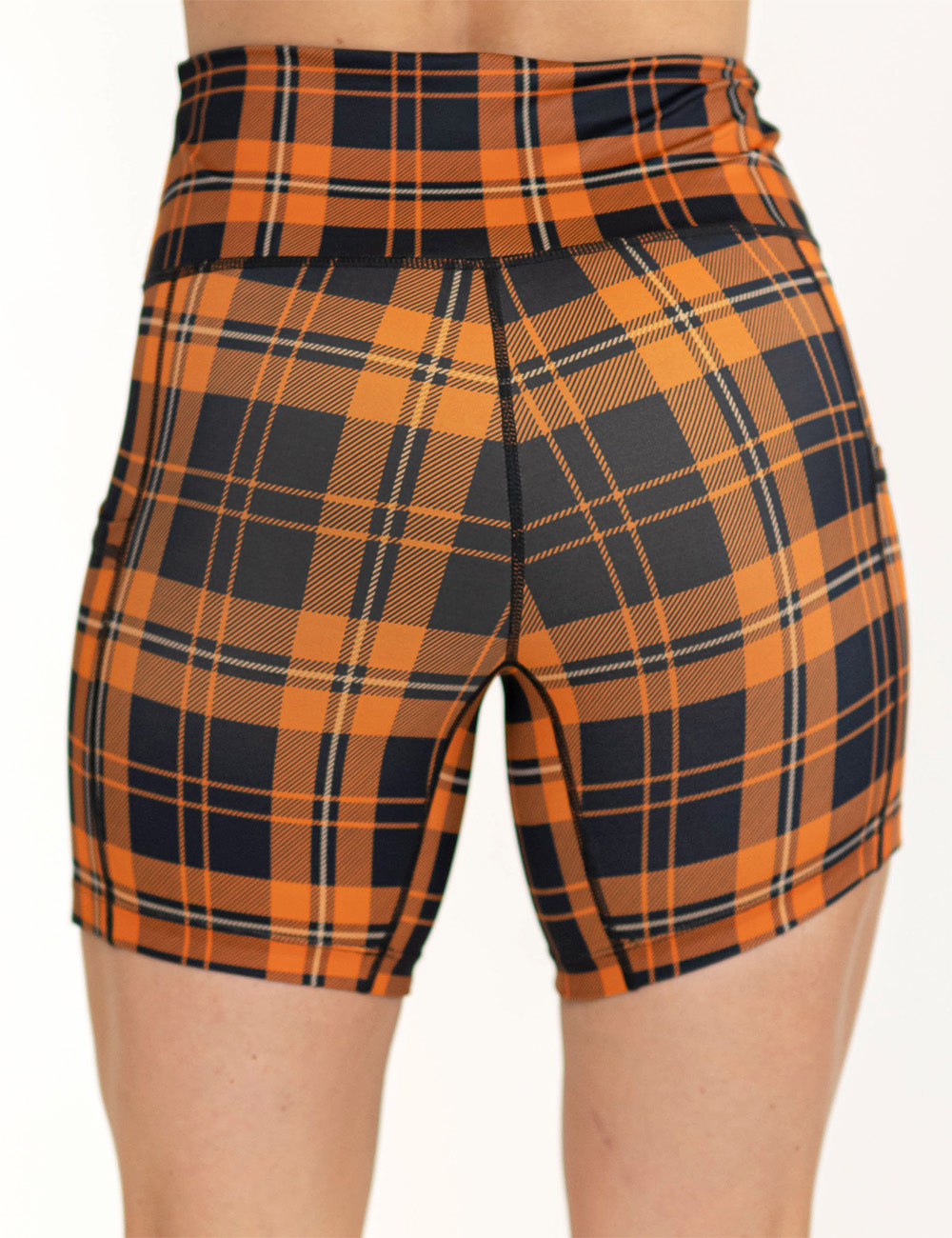 back of the 5 inch black and orange plaid shorts against a white background