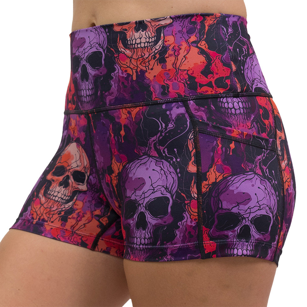purple and orange skull patterned shorts