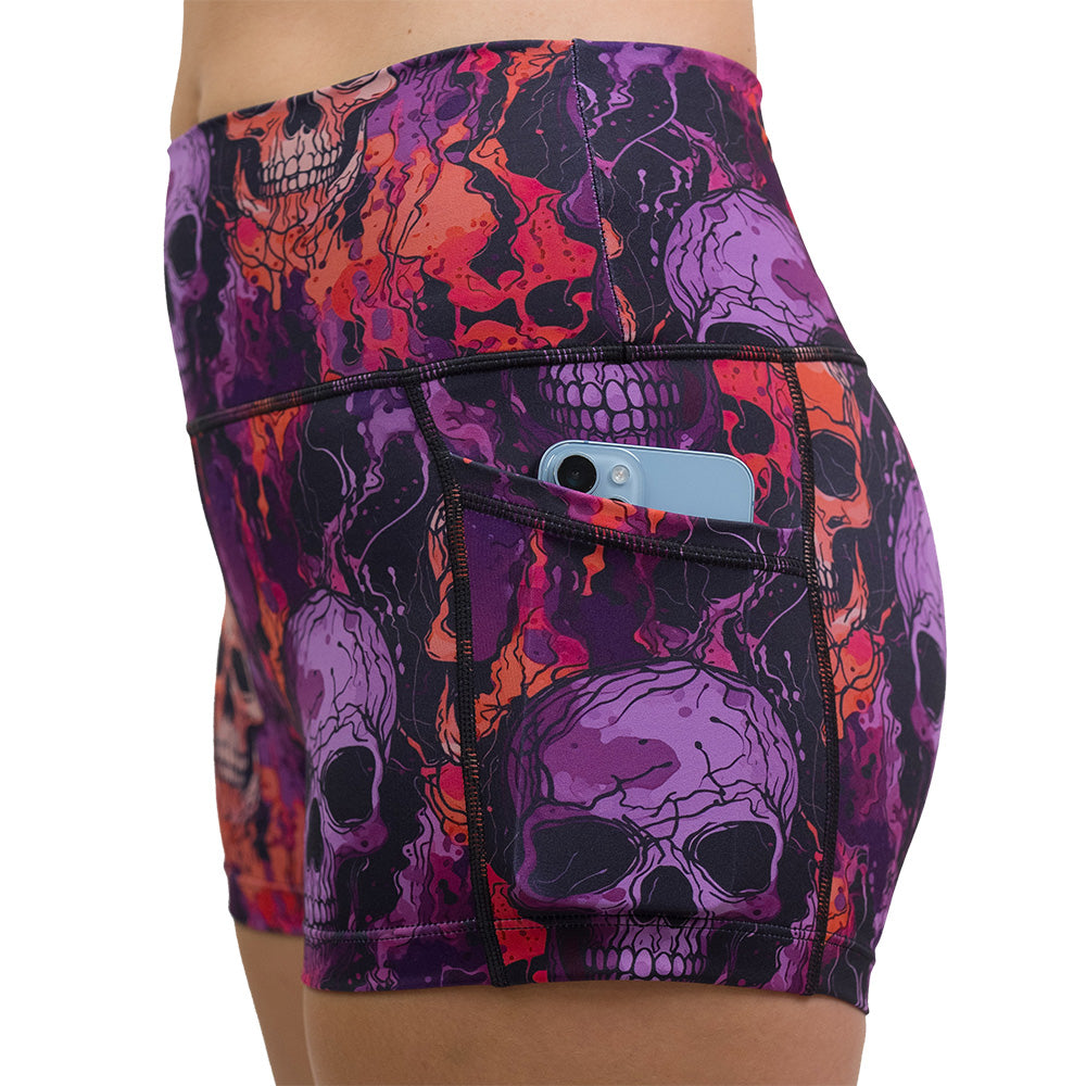 purple and orange skull patterned shorts