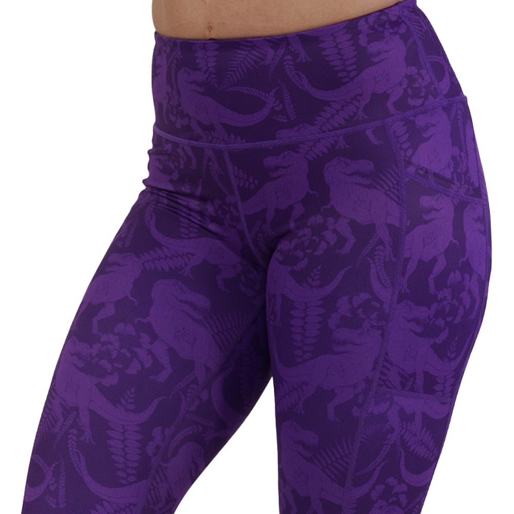 purple dinosaur patterned leggings