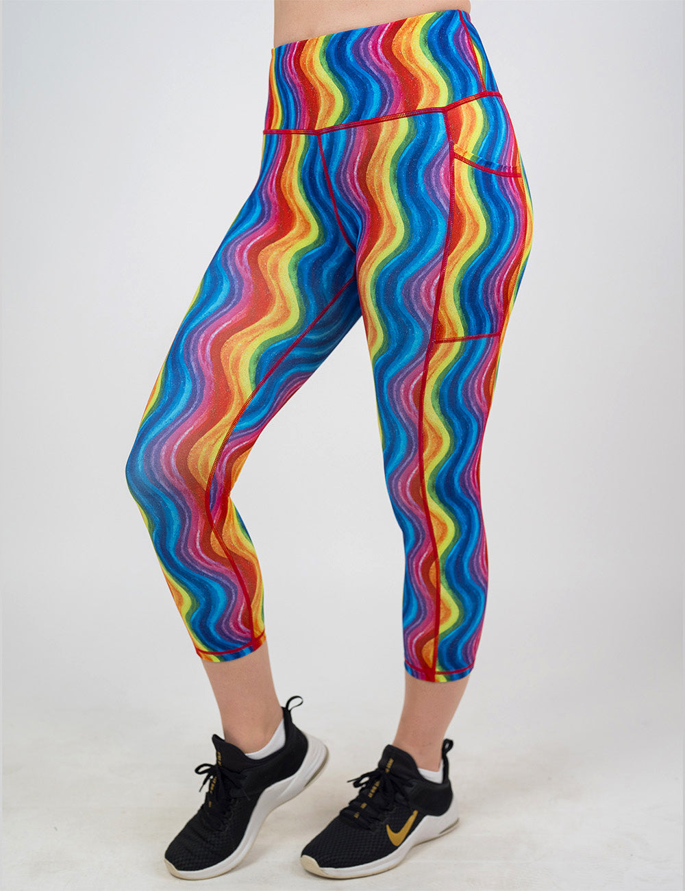 rainbow wave capri leggings facing the front against a white background