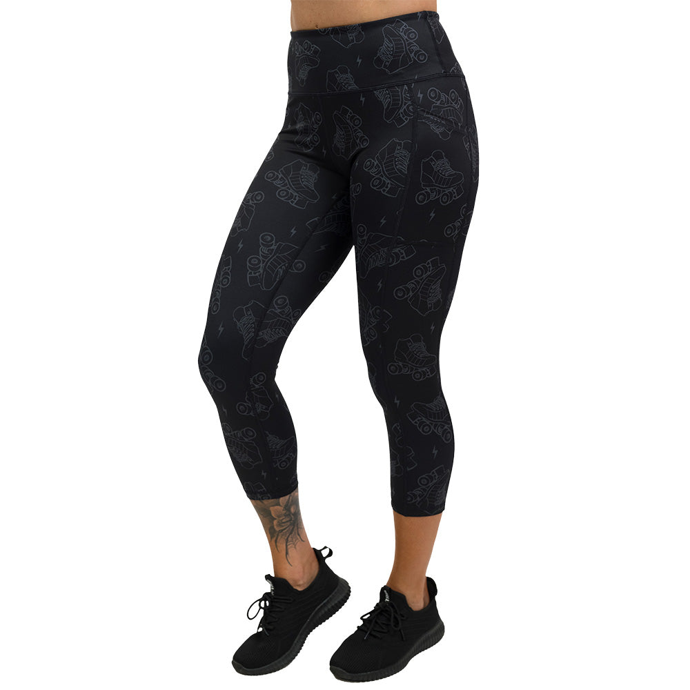 dark roller skates and lighting print leggings capri leggings facing the front