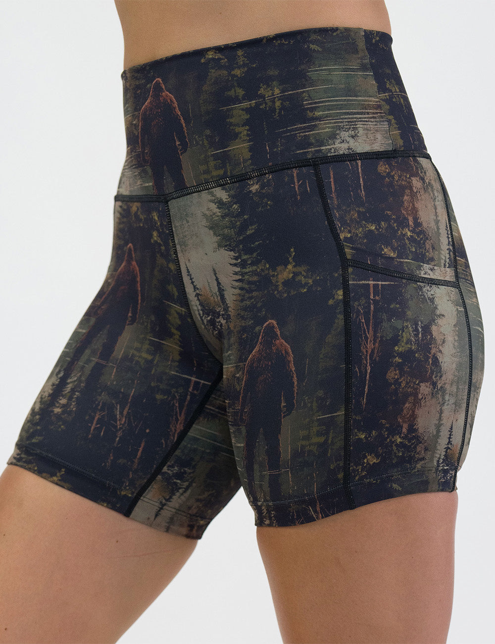 front of the bigfoot in a forest 5 inch shorts against a white background